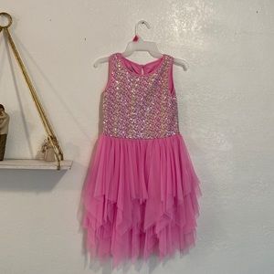 A beautiful dress by Marmelleta with rainbow sequins and ruffle skirt.